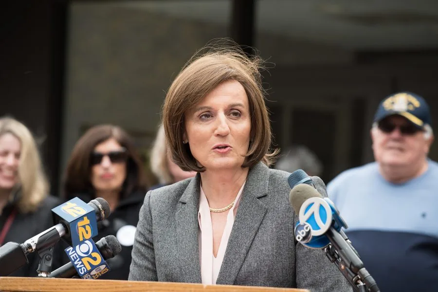 Divorce attorney Kristen Prata Browde speaking to television reporters outside a New York courthouse